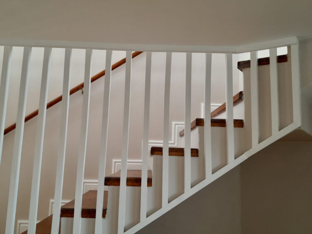 Timber stairway with white skirting finish